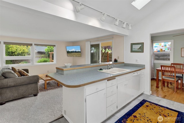 2708 Lynn St, Bellingham, WA 98225 - kitchen featuring a sink, rail lighting, a peninsula, and healthy amount of natural light