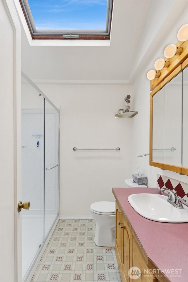 2708 Lynn St, Bellingham, WA 98225 - full bath featuring vanity, a shower stall, a skylight, and toilet