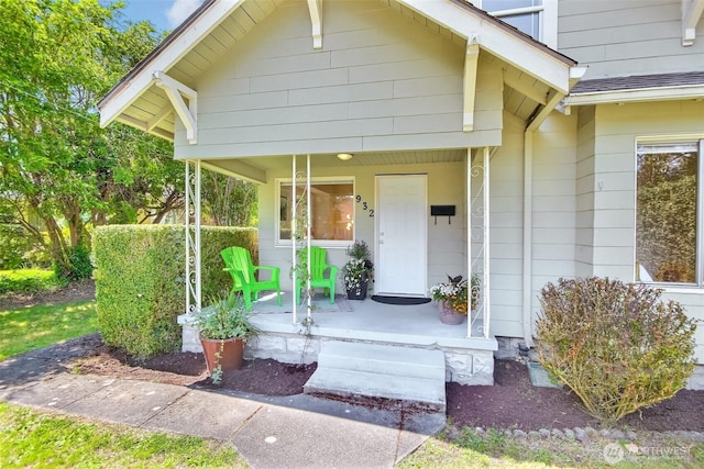 932 N Alder St, Tacoma, WA 98406 - doorway to property featuring covered porch and a shingled roof