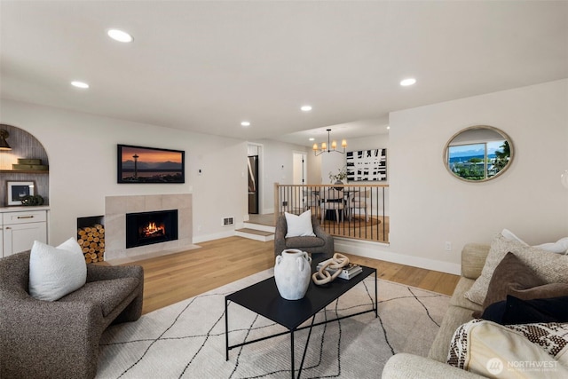 200 James St Unit 206, Edmonds, WA 98020 - living area with a chandelier, light wood-style floors, a tile fireplace, recessed lighting, and baseboards