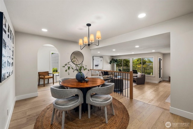 200 James St Unit 206, Edmonds, WA 98020 - dining room with arched walkways, light wood finished floors, recessed lighting, and baseboards