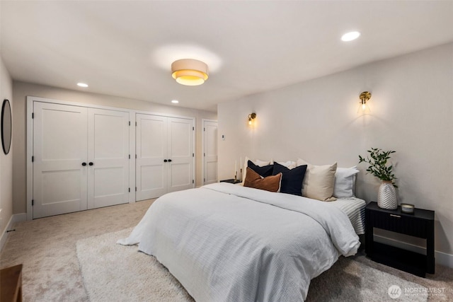 200 James St Unit 206, Edmonds, WA 98020 - bedroom featuring carpet floors, multiple closets, recessed lighting, and baseboards