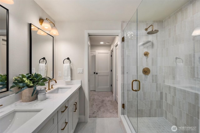 200 James St Unit 206, Edmonds, WA 98020 - bathroom with tile patterned floors, a stall shower, and double vanity