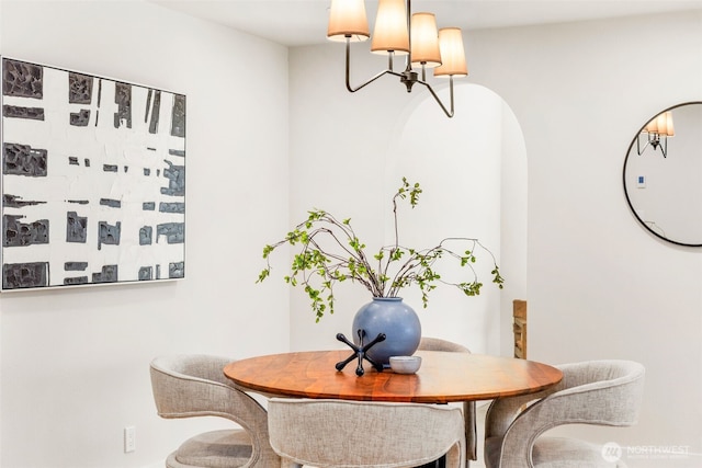 200 James St Unit 206, Edmonds, WA 98020 - dining space with a chandelier and arched walkways