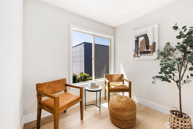 200 James St Unit 206, Edmonds, WA 98020 - sitting room with light wood finished floors and baseboards