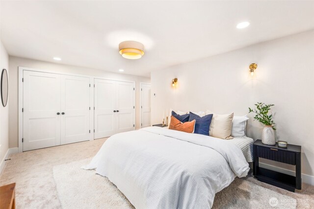 200 James St Unit 206, Edmonds, WA 98020 - bedroom with carpet flooring, multiple closets, recessed lighting, and baseboards