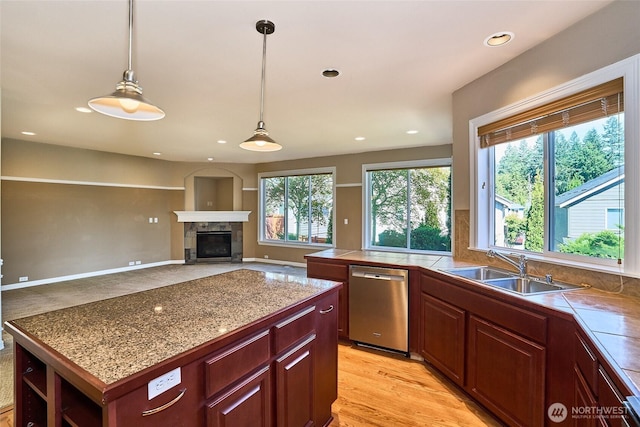 27006 229th Pl SE, Maple Valley, WA 98038 - kitchen with dishwasher, a sink, decorative light fixtures, a tile fireplace, and recessed lighting