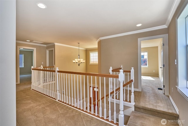 27006 229th Pl SE, Maple Valley, WA 98038 - corridor featuring carpet, a chandelier, an upstairs landing, crown molding, and healthy amount of natural light