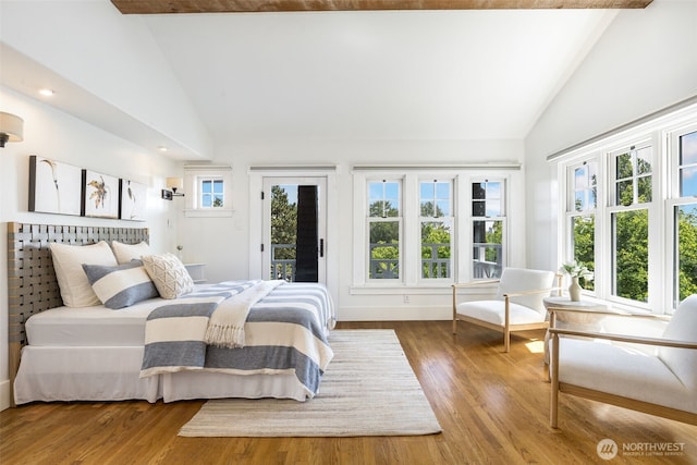 1542 Grand Ave, Seattle, WA 98122 - bedroom with access to exterior, high vaulted ceiling, and wood finished floors