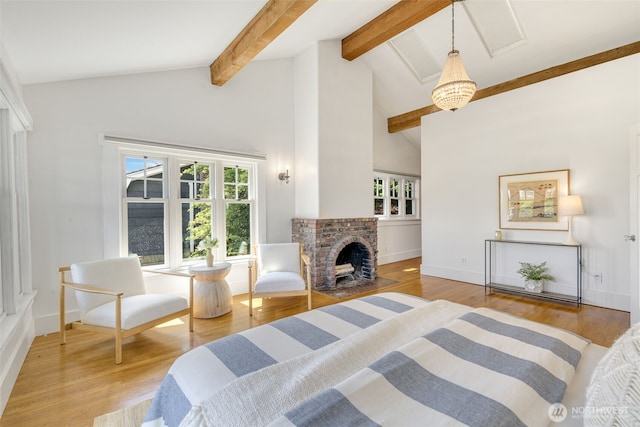 1542 Grand Ave, Seattle, WA 98122 - bedroom with beamed ceiling, multiple windows, wood finished floors, high vaulted ceiling, and a fireplace