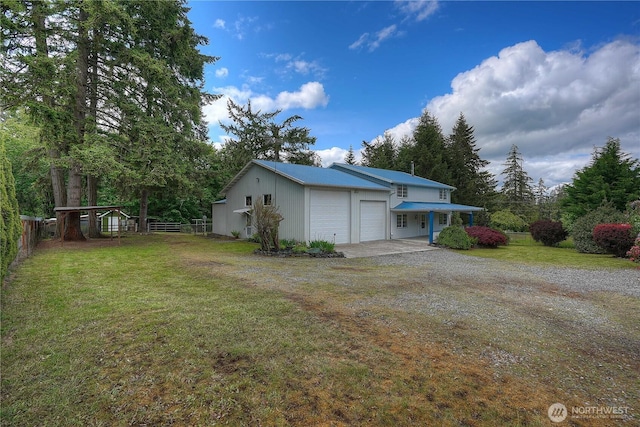 818 295th St E, Roy, WA 98580 - view of yard with a garage and gravel driveway