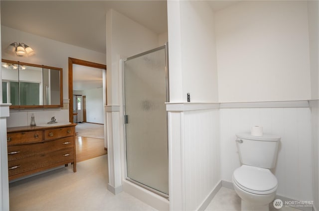 818 295th St E, Roy, WA 98580 - full bathroom with wainscoting, a shower stall, vanity, and toilet