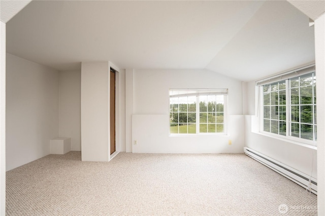 818 295th St E, Roy, WA 98580 - unfurnished room with a baseboard radiator, carpet, and lofted ceiling