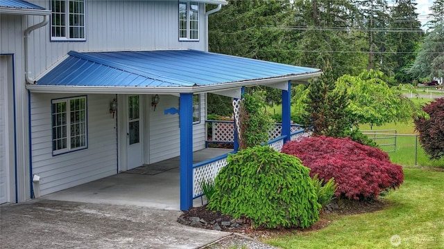 818 295th St E, Roy, WA 98580 - doorway to property featuring covered porch and metal roof