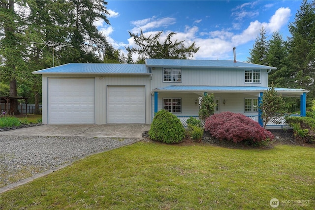818 295th St E, Roy, WA 98580 - view of front of home featuring driveway, metal roof, a porch, a front yard, and a garage
