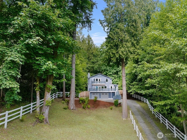 17655 Division Ave NE, Suquamish, WA 98392 - view of yard featuring dirt driveway and an attached garage