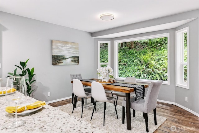 17655 Division Ave NE, Suquamish, WA 98392 - dining area featuring wood finished floors and baseboards