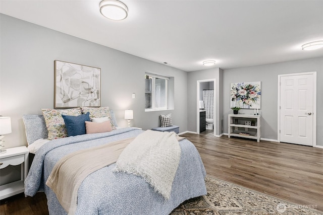 17655 Division Ave NE, Suquamish, WA 98392 - bedroom featuring wood finished floors, baseboards, and connected bathroom