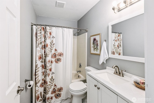 17655 Division Ave NE, Suquamish, WA 98392 - bathroom featuring toilet, vanity, and shower / bath combo with shower curtain