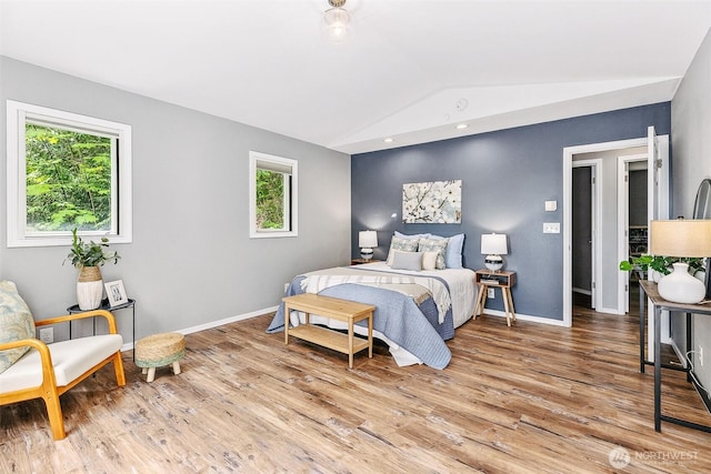 17655 Division Ave NE, Suquamish, WA 98392 - bedroom featuring vaulted ceiling, light wood finished floors, and baseboards