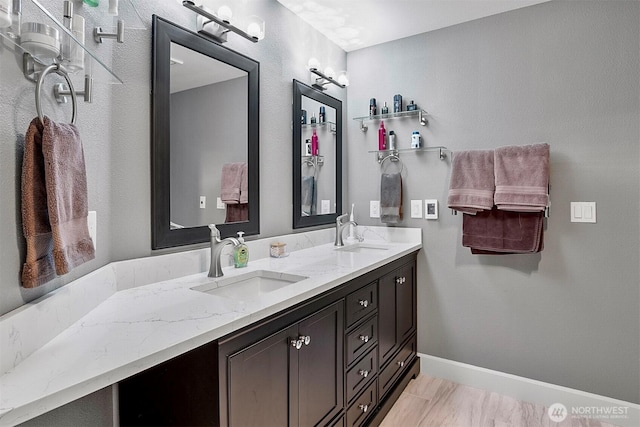 15530 73rd Ave SE, Snohomish, WA 98296 - bathroom featuring double vanity and baseboards