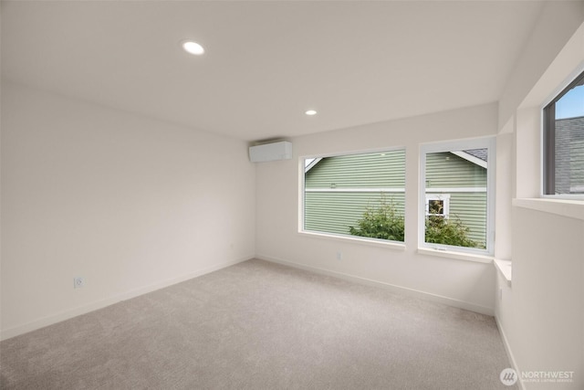 9223A 14th Ave NW, Seattle, WA 98117 - carpeted empty room featuring a wall mounted air conditioner, recessed lighting, and baseboards