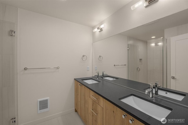 9223A 14th Ave NW, Seattle, WA 98117 - full bathroom featuring double vanity, a shower stall, baseboards, heating unit, and tile patterned floors
