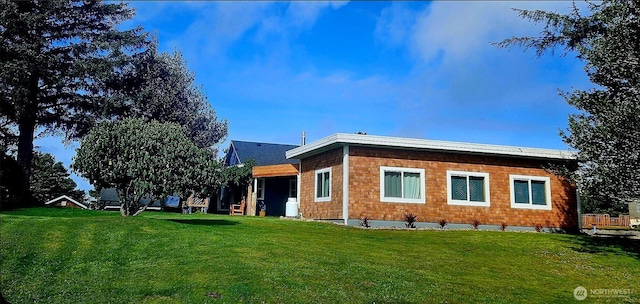 211 NW 25th St, Long Beach, WA 98631 - back of house with a lawn
