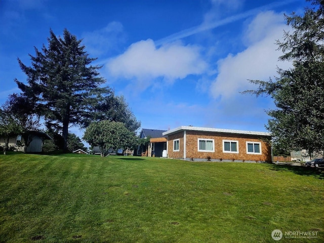 211 NW 25th St, Long Beach, WA 98631 - view of side of home with a lawn
