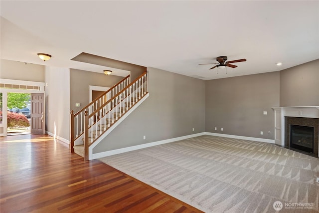 19333 205th St E, Orting, WA 98360 - unfurnished living room with baseboards, stairway, ceiling fan, and wood finished floors