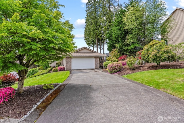 8 Clearview Dr, Longview, WA 98632 - view of front of home featuring a front yard, driveway, brick siding, and a garage