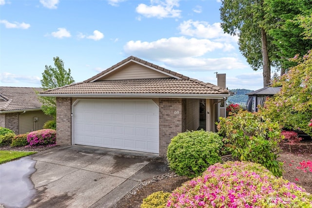 8 Clearview Dr, Longview, WA 98632 - ranch-style house with a tiled roof, brick siding, driveway, and a garage
