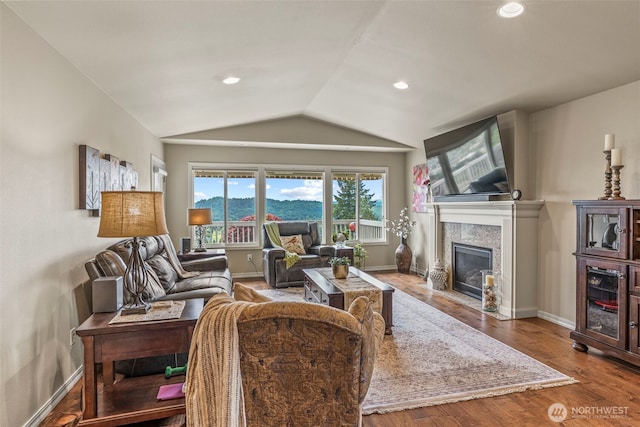 8 Clearview Dr, Longview, WA 98632 - living room featuring vaulted ceiling, a fireplace, wood finished floors, baseboards, and recessed lighting