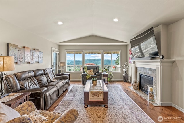 8 Clearview Dr, Longview, WA 98632 - living room featuring vaulted ceiling, wood finished floors, a fireplace, baseboards, and recessed lighting