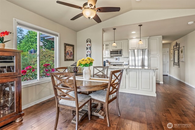 8 Clearview Dr, Longview, WA 98632 - dining space with dark wood-style flooring, vaulted ceiling, a ceiling fan, and baseboards