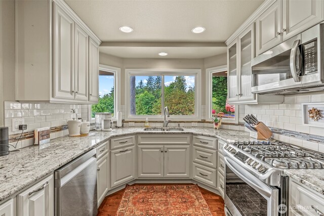 8 Clearview Dr, Longview, WA 98632 - kitchen with a sink, appliances with stainless steel finishes, white cabinetry, recessed lighting, and tasteful backsplash