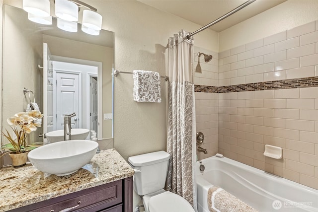 8 Clearview Dr, Longview, WA 98632 - bathroom featuring vanity, shower / bath combo with shower curtain, a textured wall, and toilet