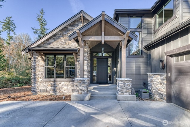 3 Crescent Valley Dr NW, Gig Harbor, WA 98332 - doorway to property featuring stone siding and a garage