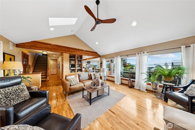 714 13th St, Bellingham, WA 98225 - living area with light wood-style floors, a ceiling fan, stairs, a skylight, and high vaulted ceiling