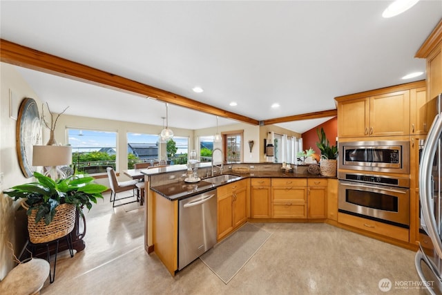 714 13th St, Bellingham, WA 98225 - kitchen featuring stainless steel appliances, a sink, dark stone counters, recessed lighting, and pendant lighting