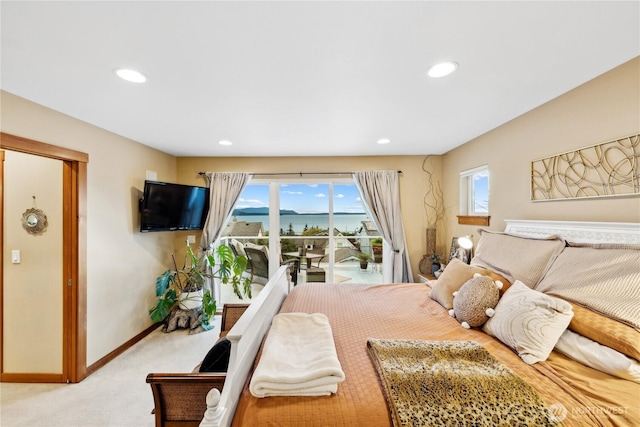 714 13th St, Bellingham, WA 98225 - bedroom with light carpet, recessed lighting, baseboards, and access to exterior