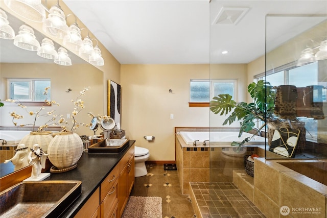 714 13th St, Bellingham, WA 98225 - full bathroom featuring a bath, vanity, toilet, baseboards, and tile patterned floors