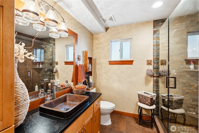 714 13th St, Bellingham, WA 98225 - full bathroom with vanity, a stall shower, toilet, and baseboards