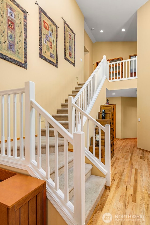 2041 NW Tregaten Ln, Poulsbo, WA 98370 - staircase with wood finished floors and recessed lighting