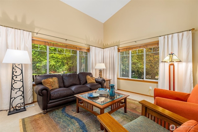 2041 NW Tregaten Ln, Poulsbo, WA 98370 - living area with carpet flooring, high vaulted ceiling, plenty of natural light, and baseboards