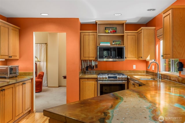 2041 NW Tregaten Ln, Poulsbo, WA 98370 - kitchen with stainless steel appliances, a sink, open shelves, and recessed lighting