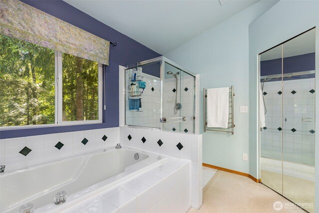 2041 NW Tregaten Ln, Poulsbo, WA 98370 - bathroom with a shower stall, a bath, and baseboards