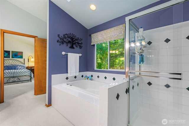2041 NW Tregaten Ln, Poulsbo, WA 98370 - bathroom with a stall shower, a bath, lofted ceiling, and baseboards