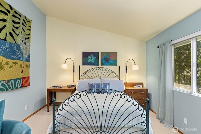 2041 NW Tregaten Ln, Poulsbo, WA 98370 - bedroom featuring light carpet, baseboards, and lofted ceiling