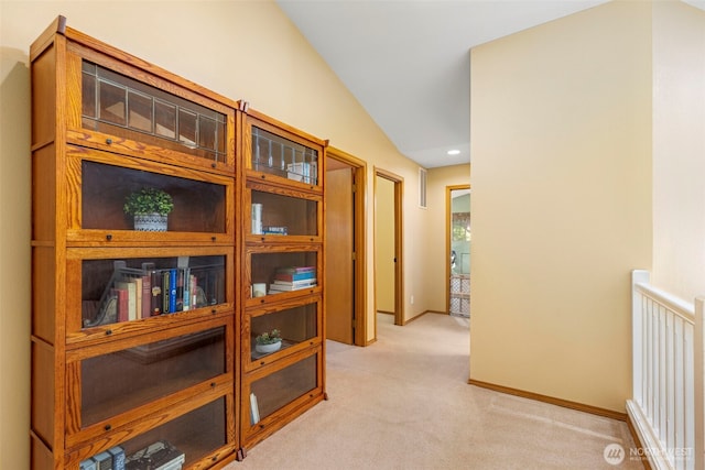 2041 NW Tregaten Ln, Poulsbo, WA 98370 - hallway with light carpet, lofted ceiling, and baseboards